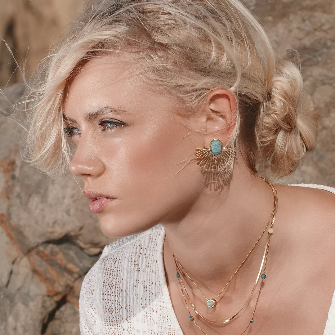 Model wearing Zard Jewelry Turquoise Fan Earrings in 18K Gold