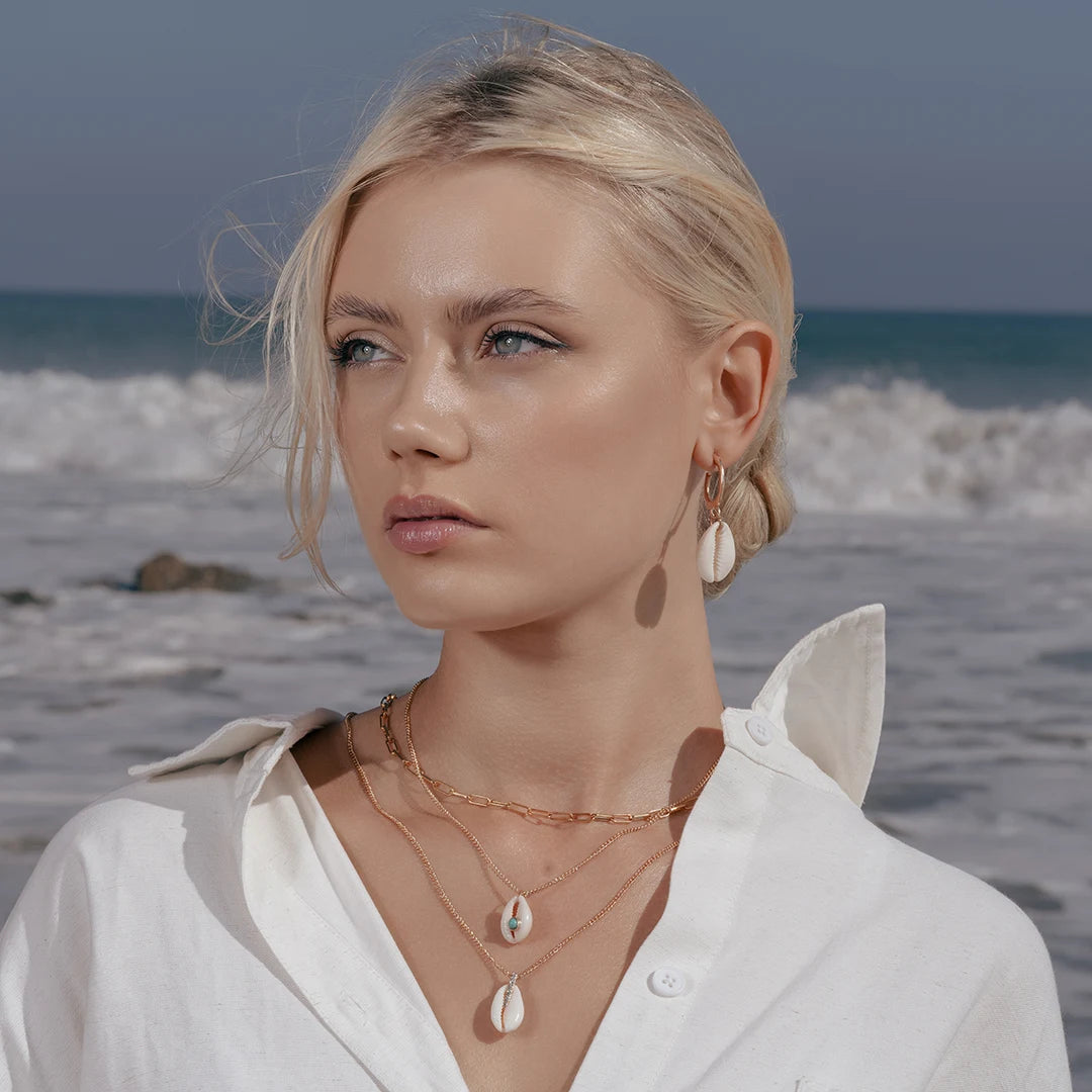Model wearing Natural Shell Charm Double Layered Necklace around her neck, close-up