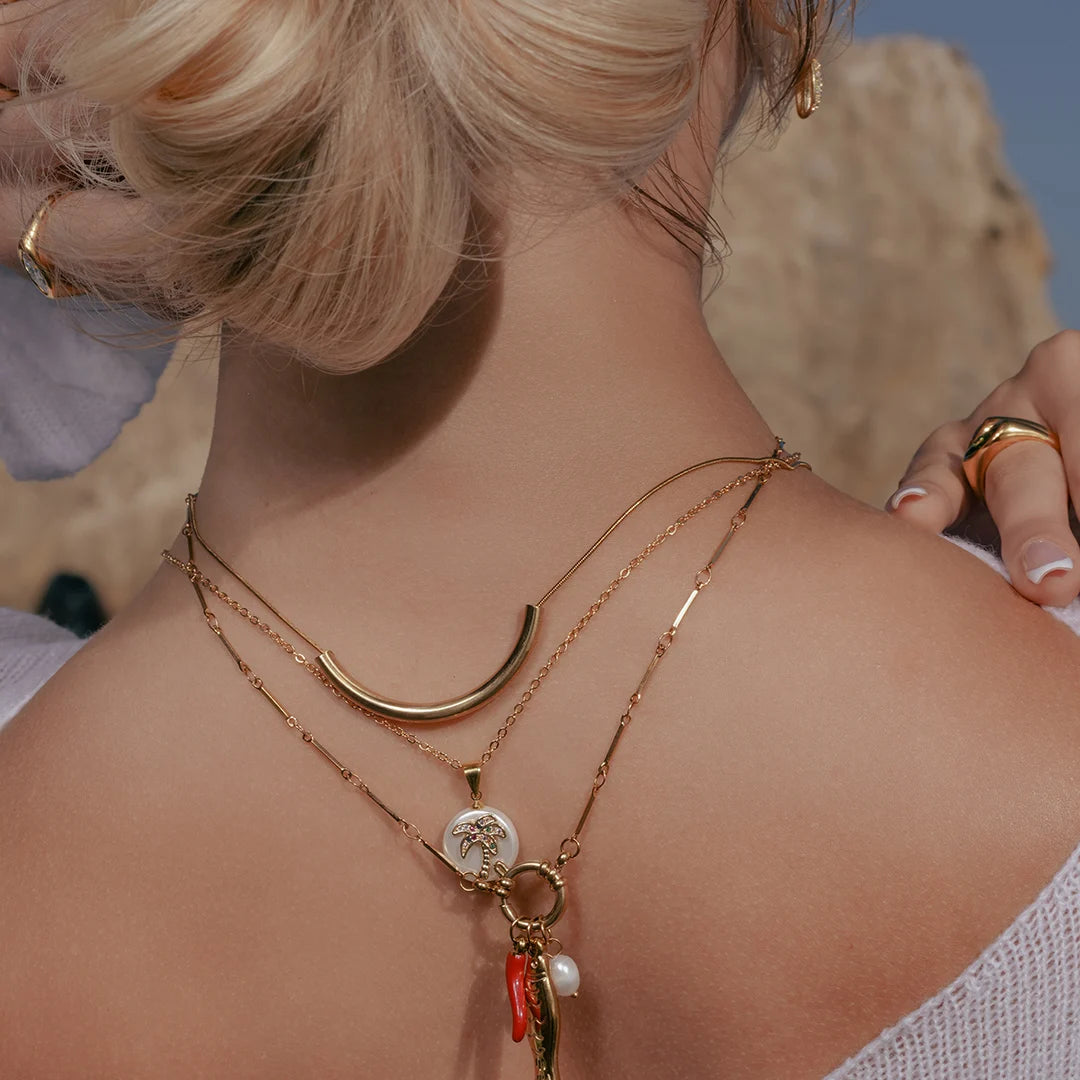 Model wearing Palm Tree Pave Pearl Charm Necklace around her neck