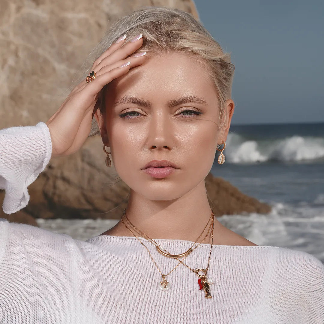 Model wearing Pearl Fish Mediterranean Charm Necklace around her neck