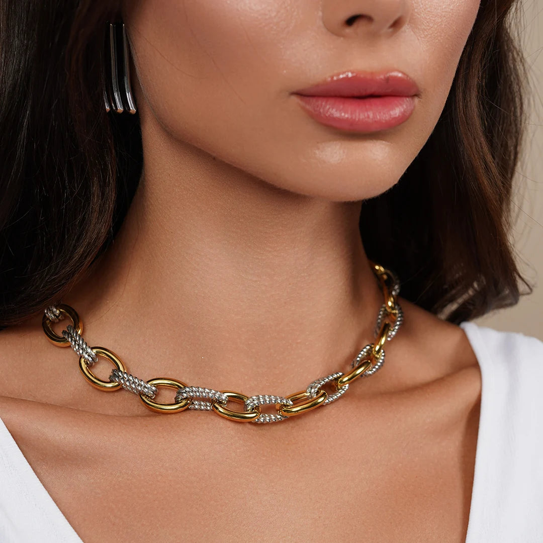 Model wearing Statement Link Chain Necklace In 18K Gold Sterling Silver Combination around her neck
