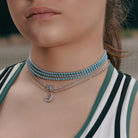 Model wearing Turquoise Tennis Choker Necklace in Gold and Silver around her neck