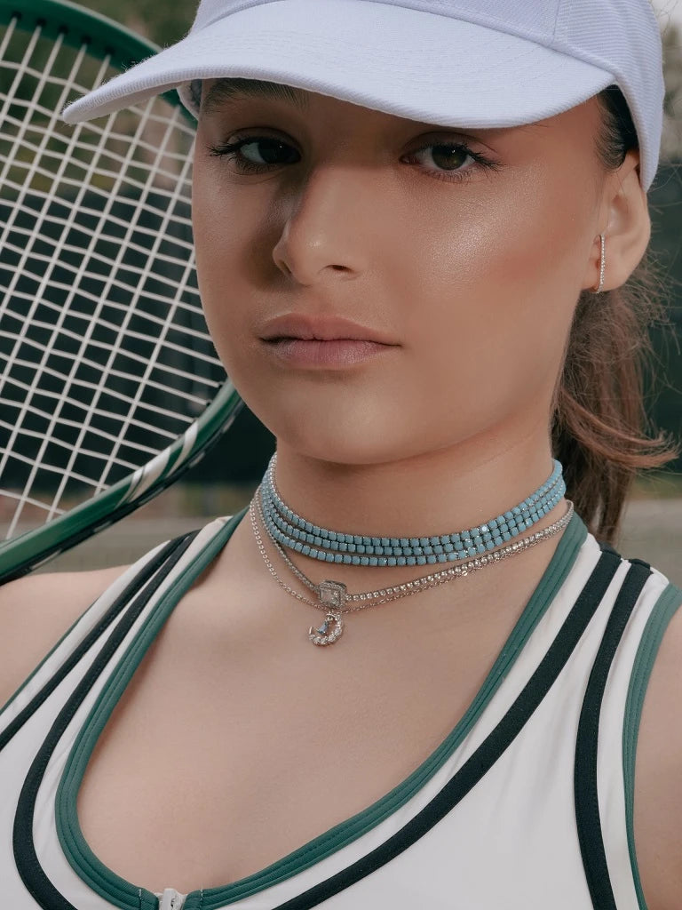Model wearing Turquoise Tennis Choker Necklace in Gold and Silver around her neck, alternate pose