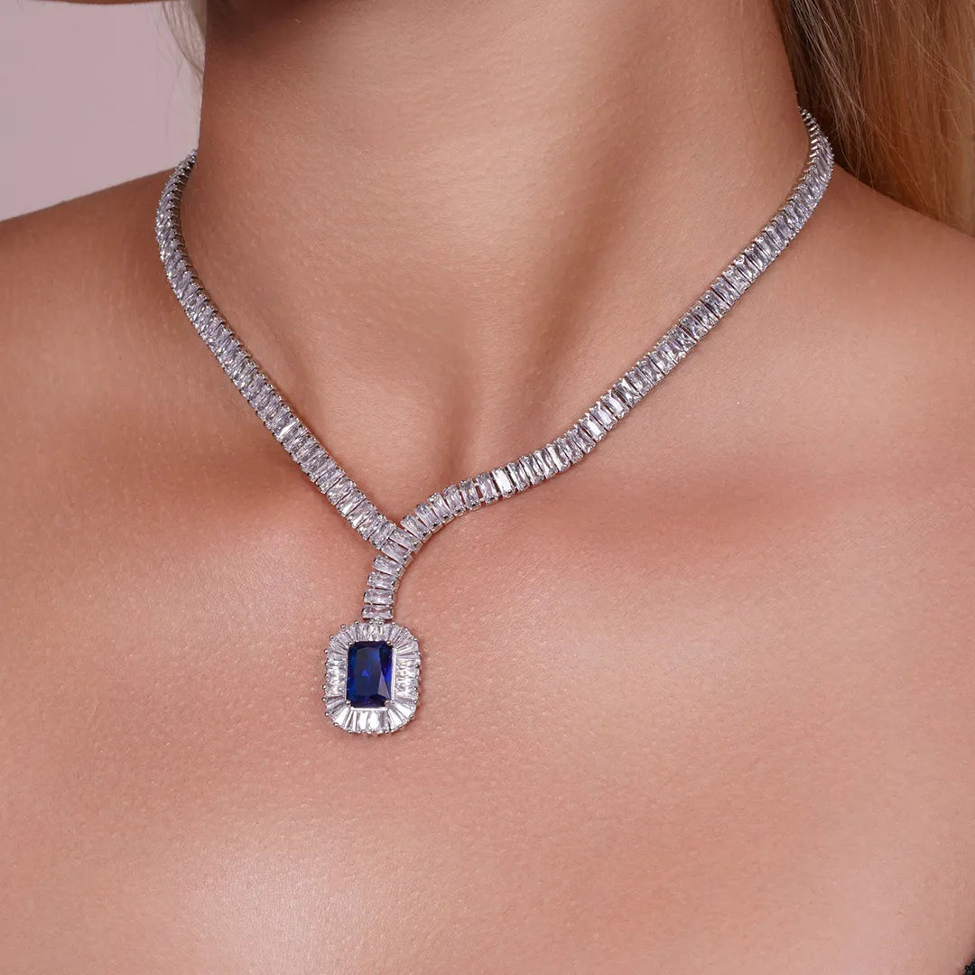 Model wearing Blue CZ Statement Tennis Necklace and Earrings Set, alternate pose