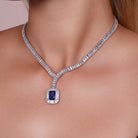Model wearing Blue CZ Statement Tennis Necklace and Earrings Set, alternate pose