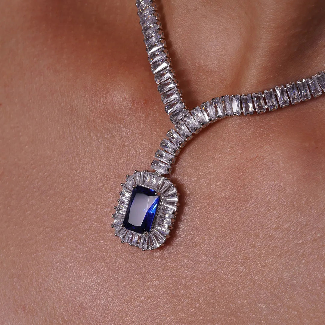 Model wearing Blue CZ Statement Tennis Necklace and Earrings Set, close-up